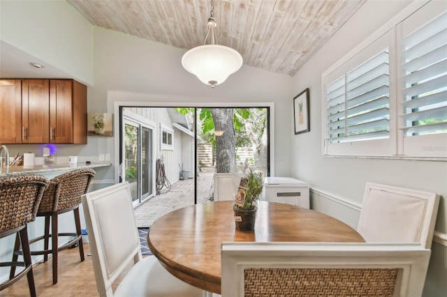 dining space with wooden ceiling and lofted ceiling