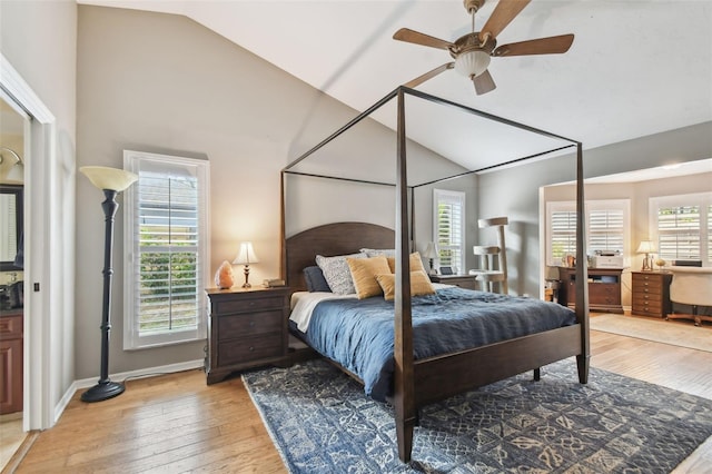 bedroom featuring ceiling fan, multiple windows, and light hardwood / wood-style flooring