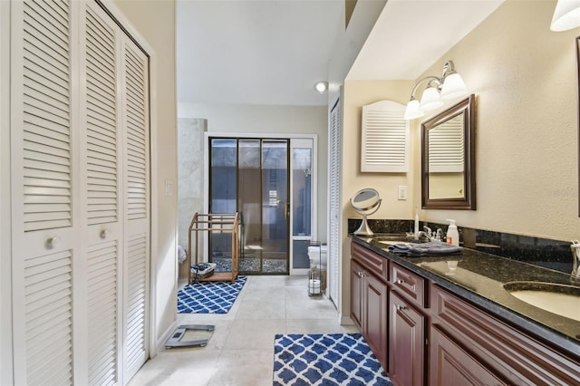 bathroom with tile patterned floors, vanity, and toilet