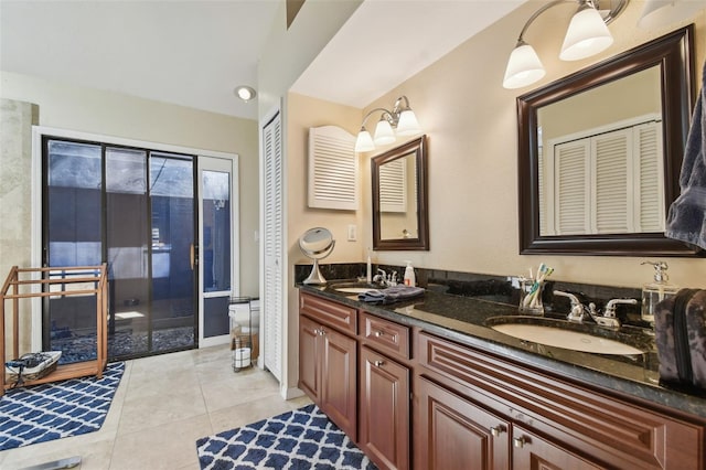 bathroom with tile patterned flooring, vanity, and toilet