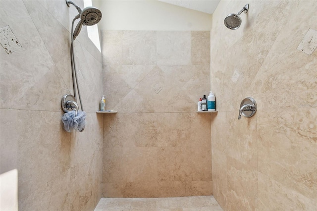 bathroom with tiled shower