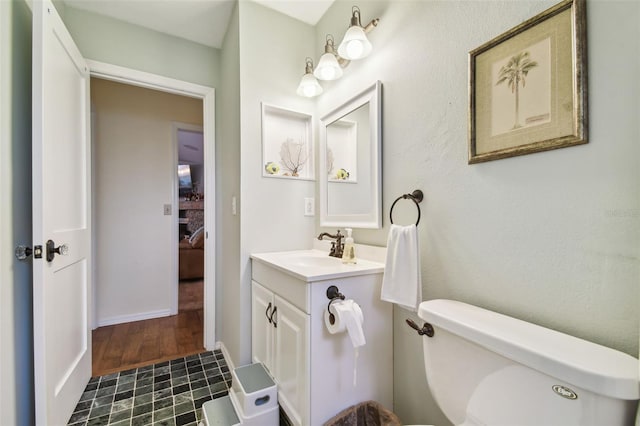 bathroom with vanity and toilet