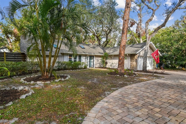 single story home featuring a garage