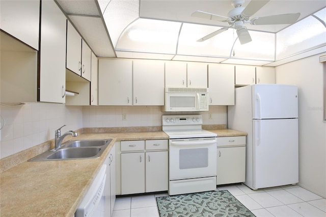 kitchen with backsplash, white appliances, sink, and light tile patterned floors