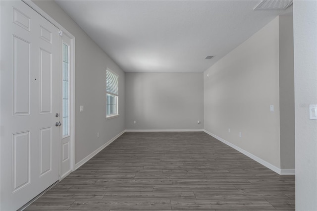 foyer with dark hardwood / wood-style flooring