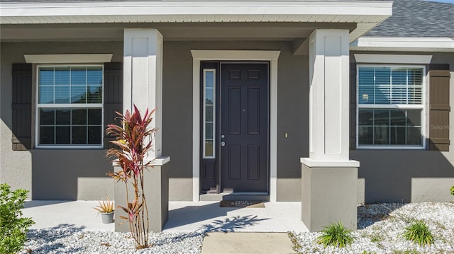 doorway to property with covered porch