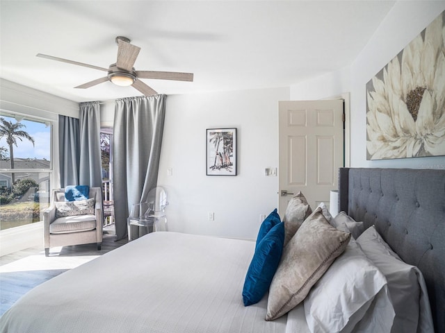 bedroom featuring ceiling fan and light hardwood / wood-style flooring