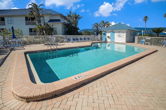 view of swimming pool with a patio