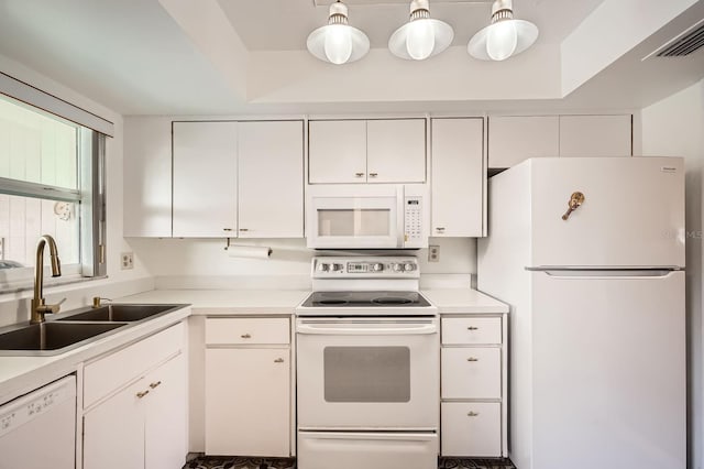 665 Park Cir Unit 58, Bradenton, FL 34207 - kitchen featuring white appliances, white cabinetry, and light countertops