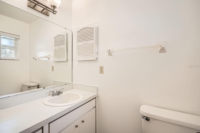 665 Park Cir Unit 58, Bradenton, FL 34207 - half bathroom featuring toilet and vanity