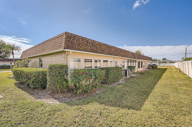 view of property exterior featuring a yard