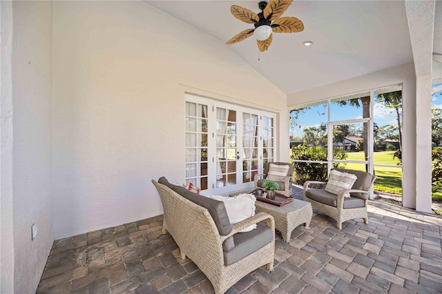 sunroom featuring french doors, ceiling fan, and lofted ceiling