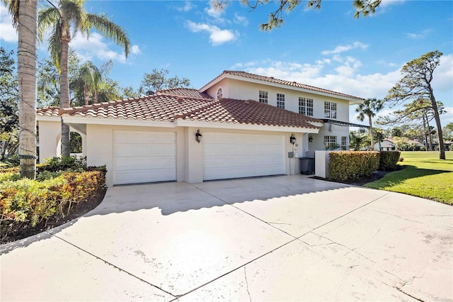 mediterranean / spanish-style house featuring a garage