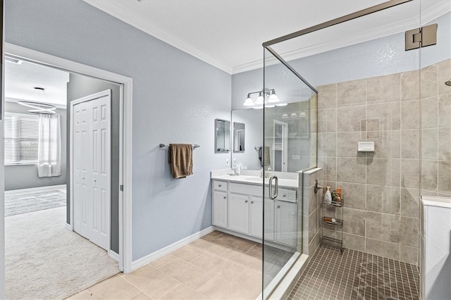 bathroom with tile patterned flooring, vanity, walk in shower, and crown molding