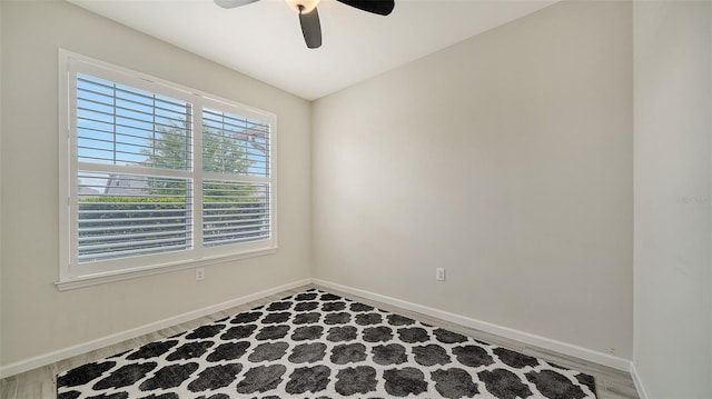 spare room featuring ceiling fan and wood-type flooring