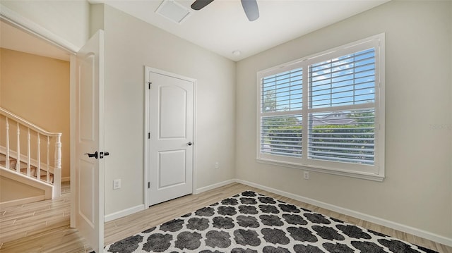 bedroom with ceiling fan and light wood-type flooring