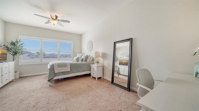 bedroom featuring ceiling fan and light carpet