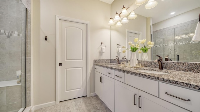 bathroom featuring tile patterned floors, vanity, and walk in shower