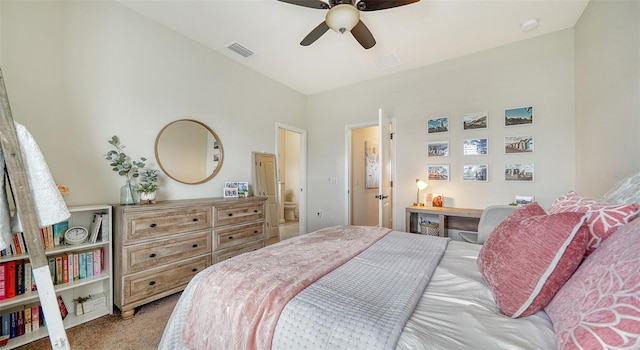 carpeted bedroom with ceiling fan and vaulted ceiling