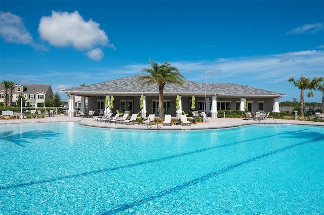 view of swimming pool with a patio