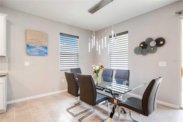 dining area with light tile patterned floors