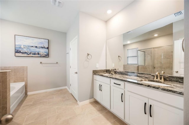 bathroom featuring plus walk in shower and vanity