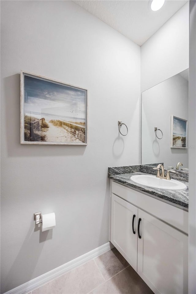 bathroom featuring tile patterned flooring and vanity