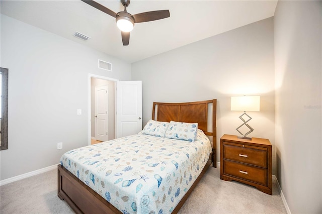 bedroom with ceiling fan, light colored carpet, and lofted ceiling