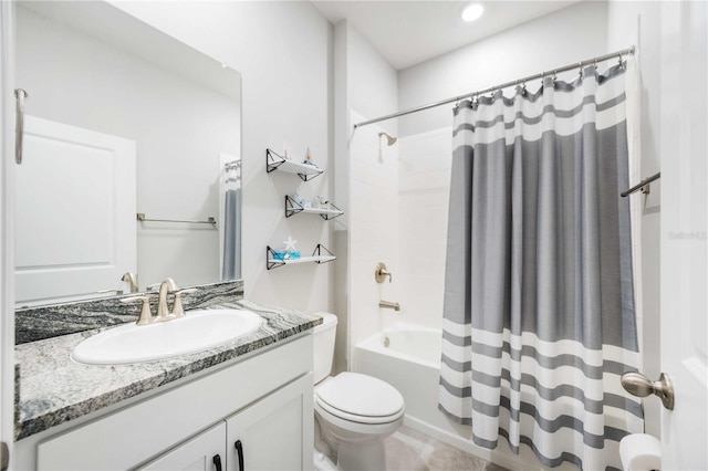 full bathroom with vanity, toilet, and shower / tub combo