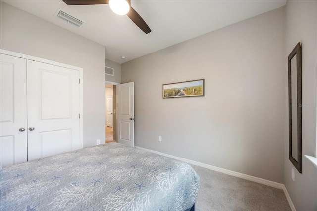 unfurnished bedroom featuring ceiling fan, carpet floors, and a closet