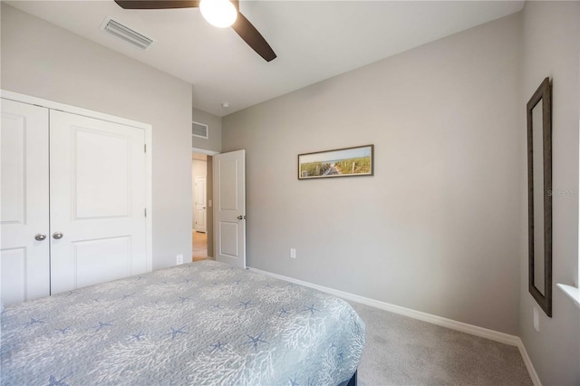 12689 Promenade Estates Blvd, Sarasota, FL 34238 - bedroom with carpet floors, a closet, and a ceiling fan