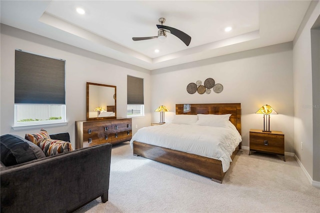 12689 Promenade Estates Blvd, Sarasota, FL 34238 - carpeted bedroom with a tray ceiling, recessed lighting, and a ceiling fan
