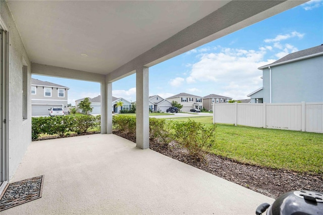 12689 Promenade Estates Blvd, Sarasota, FL 34238 - view of patio / terrace featuring a residential view