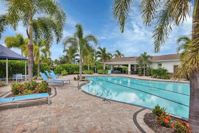 view of swimming pool with a gazebo and a patio