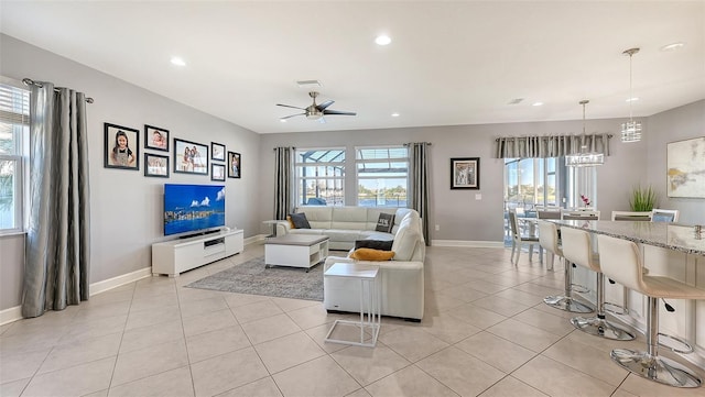 living room with light tile patterned floors and ceiling fan