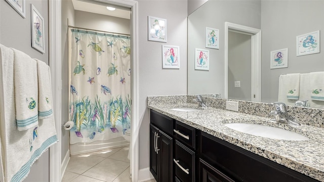 bathroom with shower / tub combo, vanity, and tile patterned floors