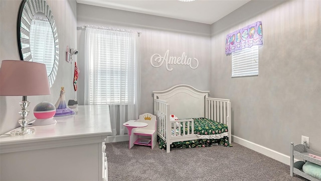 carpeted bedroom with a crib