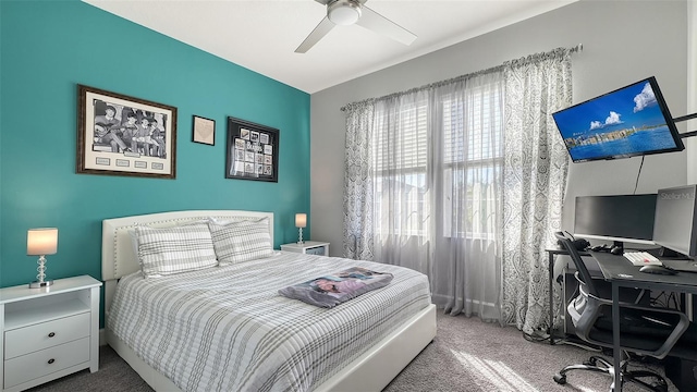 bedroom featuring ceiling fan and carpet