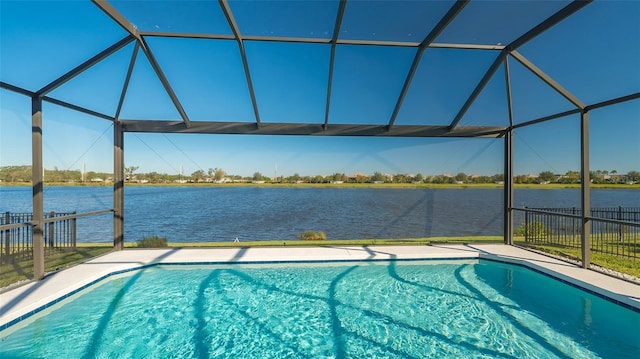 view of swimming pool featuring a lanai and a water view