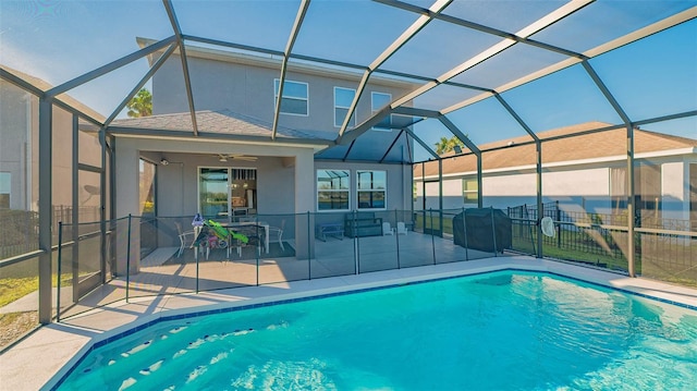 view of swimming pool with a lanai, area for grilling, ceiling fan, and a patio area