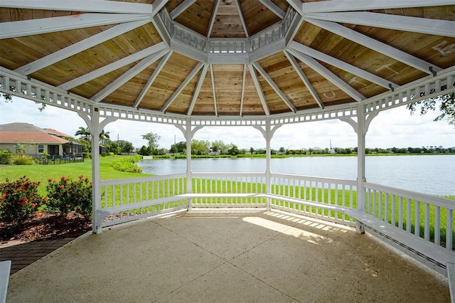 view of patio with a gazebo and a water view