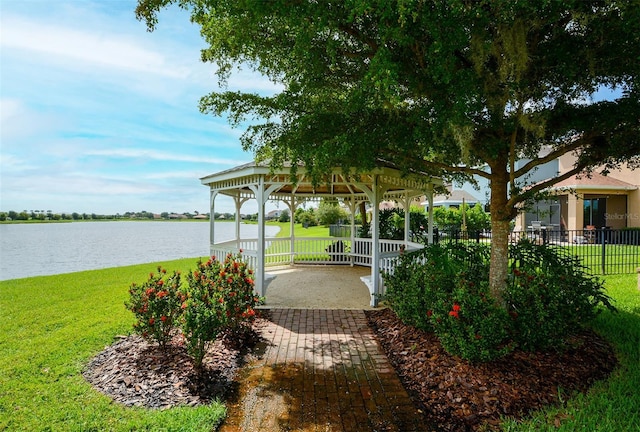 view of yard featuring a gazebo and a water view