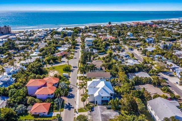 birds eye view of property featuring a water view and a view of the beach