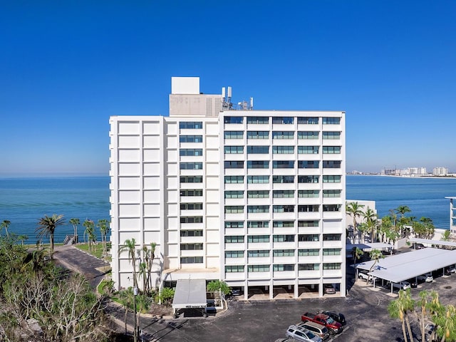 view of property featuring a view of city and a water view