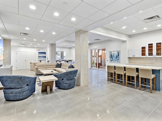 living area featuring recessed lighting and visible vents