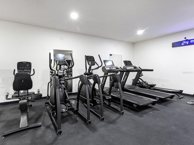 exercise room featuring recessed lighting and baseboards