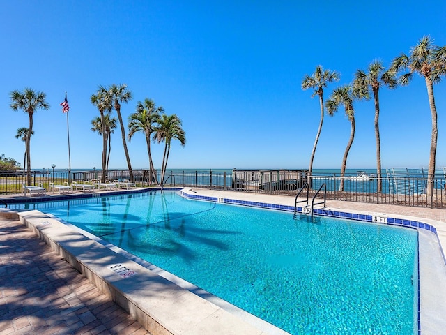 community pool featuring a patio area and fence