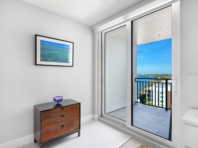 entryway featuring baseboards