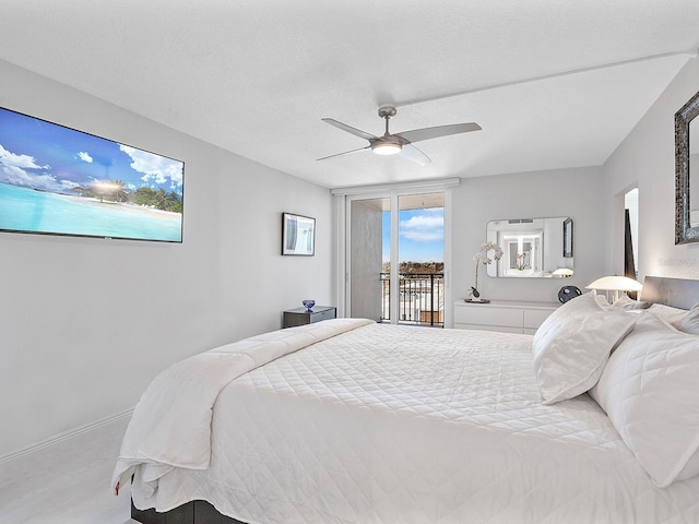 bedroom featuring ceiling fan, baseboards, and access to exterior