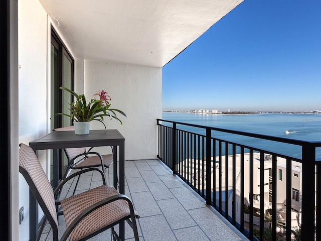 balcony featuring a water view